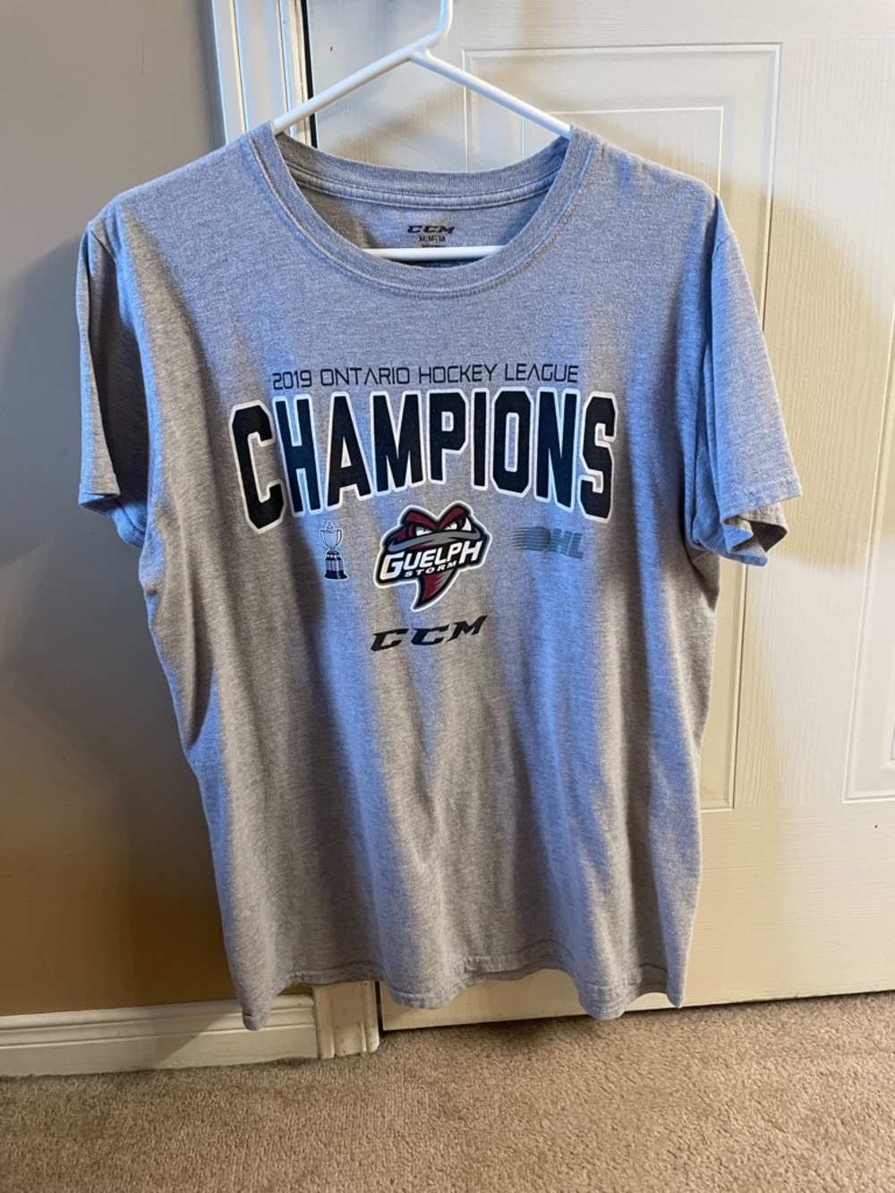 CCM Grey 2019 Guelph Storm Champions Hockey T-Shirt